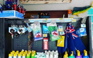 fly poles key chains sun block and the TCI flag for sale at Master Baits Tackle and Fishing shop in Scooter Bobs car rental office in Turtle Cove Turks and Caicos Islands fly poles key chains sun block and the TCI flag for sale at Master Baits Tackle and Fishing shop in Scooter Bobs car rental office in Turtle Cove Turks and Caicos Islands